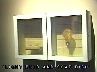Light Bulb and Soap Dish hologram sculpture by Mary Harman at Interference Gallery 1990